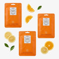 Vitamin C Sheet Mask 3-pack – tre sachets med apelsin- och citronskivor, flatlay